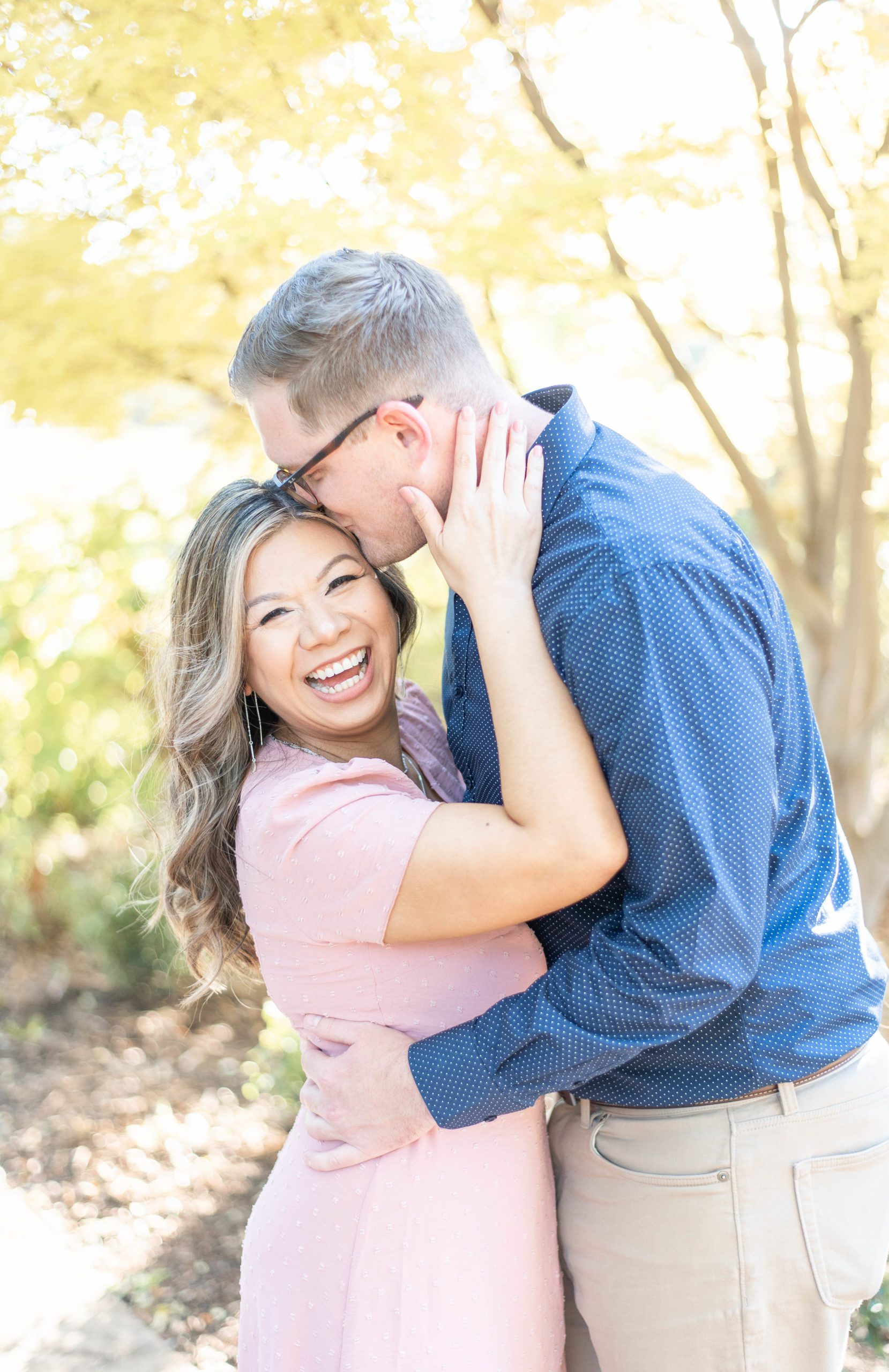 couple nuzzles closely with faces full of joy