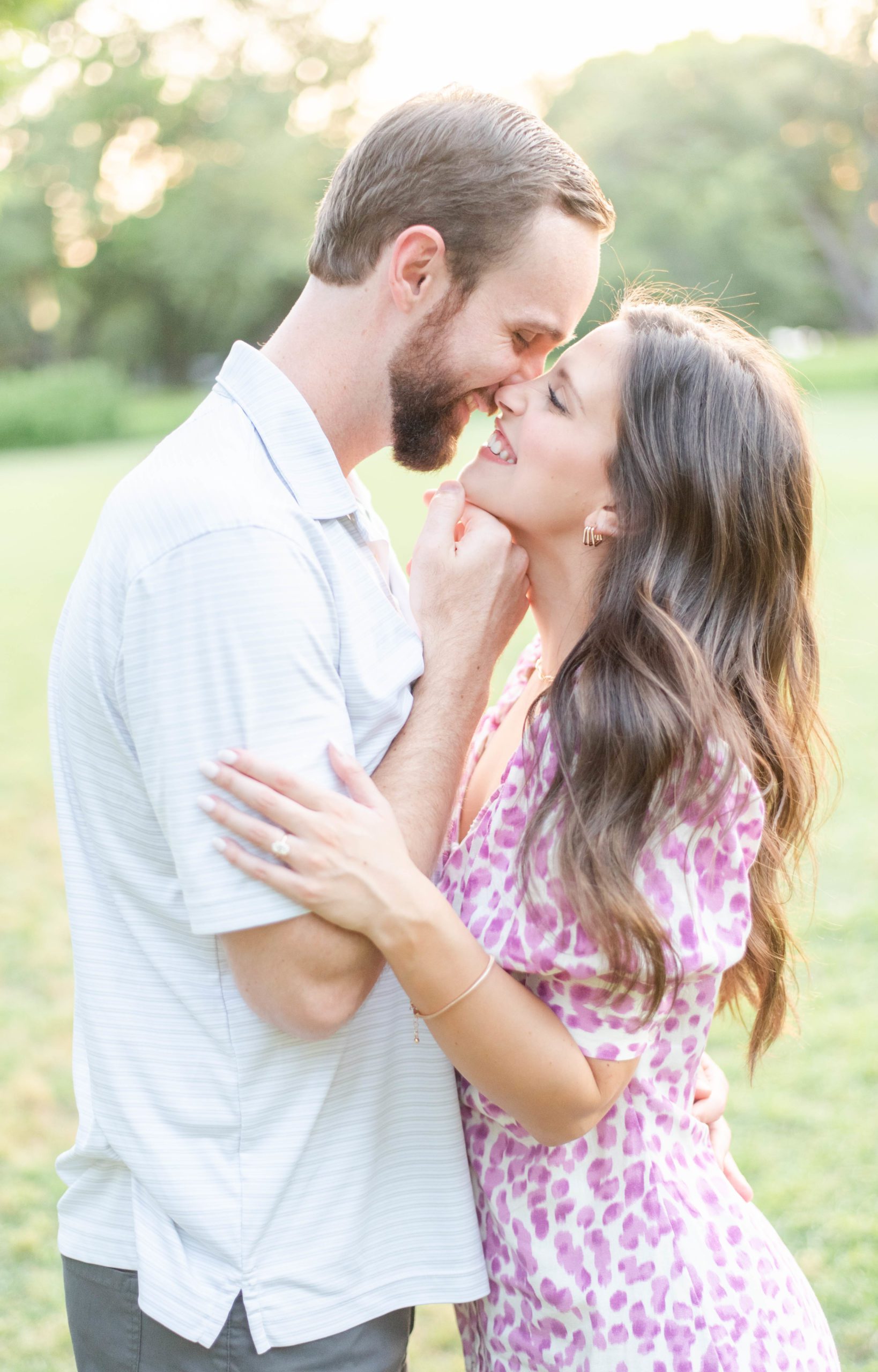 young couple lean into romantic kiss at dallas park